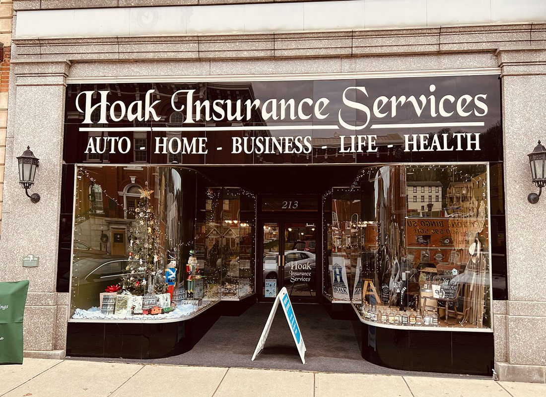 Brookville, PA - Exterior View of Hoak Insurance Services Front Entrance with Glass Windows Decorated for the Holidays in Brookville Pennsylvania